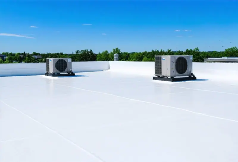 White single-ply membrane roof with two rooftop units on a sunny day